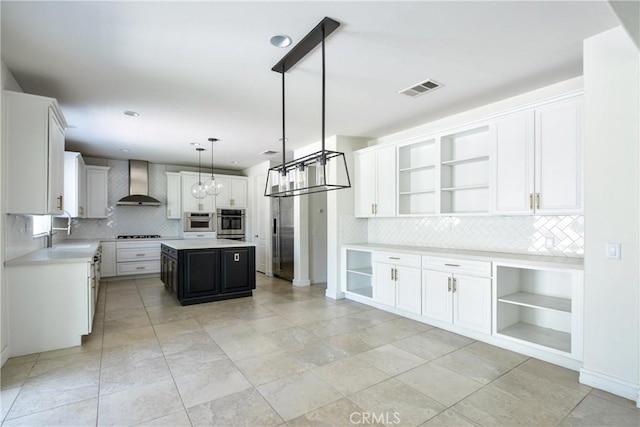 45118 Riverstone Ct, Temecula, CA 92592 - kitchen with open shelves, wall chimney exhaust hood, stainless steel appliances, decorative backsplash, and light countertops