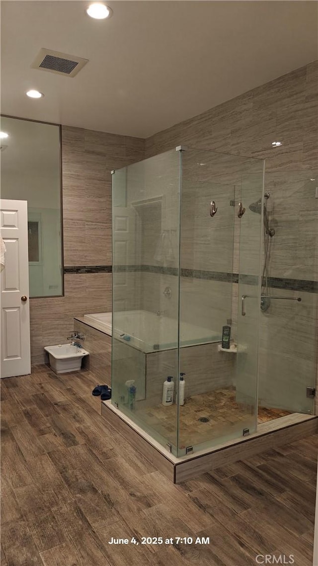 19910 Tennessee Trl, Walnut, CA 91789 - full bath featuring a stall shower, recessed lighting, and wood finished floors