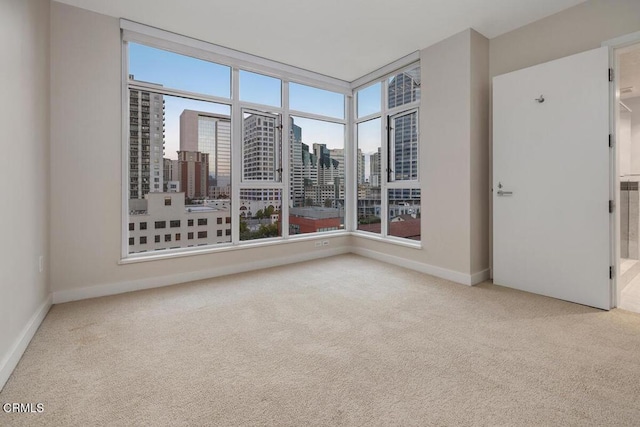 1205 Pacific Hwy Unit 1005, San Diego, CA 92101 - carpeted empty room with plenty of natural light and a city view