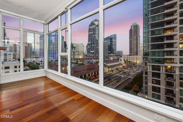 1205 Pacific Hwy Unit 1005, San Diego, CA 92101 - sunroom / solarium featuring a skyline view and wood finished floors