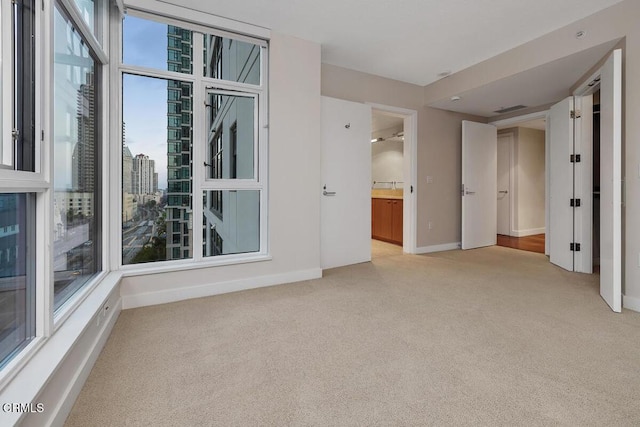1205 Pacific Hwy Unit 1005, San Diego, CA 92101 - unfurnished room with light colored carpet