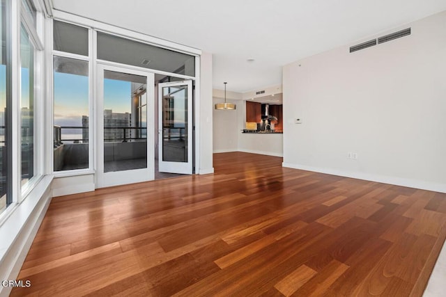 1205 Pacific Hwy Unit 1005, San Diego, CA 92101 - spare room featuring wood finished floors and plenty of natural light
