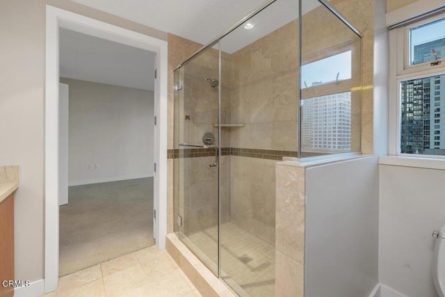 1205 Pacific Hwy Unit 1005, San Diego, CA 92101 - bathroom featuring a stall shower, vanity, and tile patterned flooring