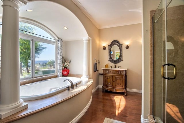 42768 El Calamar Rd, Temecula, CA 92590 - full bathroom featuring decorative columns, a stall shower, vanity, a garden tub, and wood finished floors