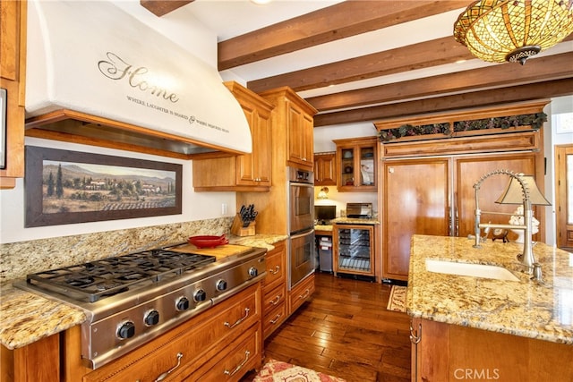 42768 El Calamar Rd, Temecula, CA 92590 - kitchen with range hood, stainless steel appliances, beverage cooler, brown cabinets, and beamed ceiling