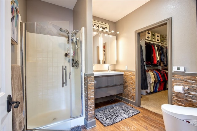 42768 El Calamar Rd, Temecula, CA 92590 - full bath featuring wood finished floors, vanity, a stall shower, and a walk in closet