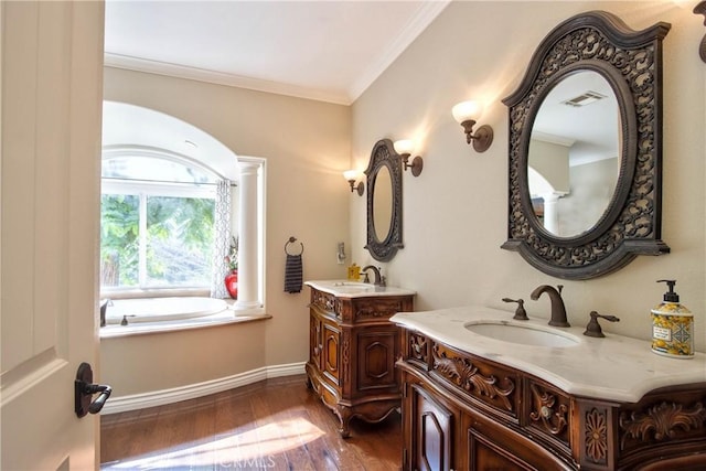 42768 El Calamar Rd, Temecula, CA 92590 - full bath featuring two vanities, wood finished floors, ornamental molding, decorative columns, and a tub
