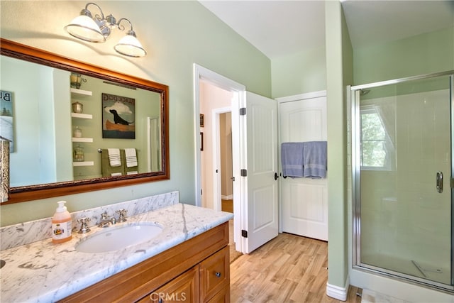 42768 El Calamar Rd, Temecula, CA 92590 - bathroom with wood finished floors, a shower stall, and vanity