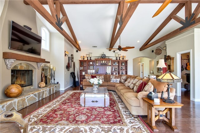 42768 El Calamar Rd, Temecula, CA 92590 - living area with arched walkways, wood finished floors, a high end fireplace, beam ceiling, and high vaulted ceiling