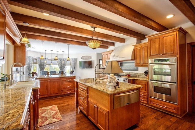 42768 El Calamar Rd, Temecula, CA 92590 - kitchen with double oven, a warming drawer, light stone countertops, brown cabinetry, and beamed ceiling