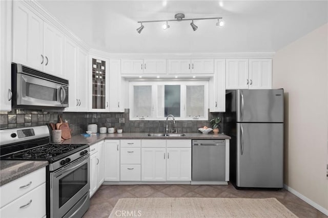 1715 Stanford Ave, Redondo Beach, CA 90278 - kitchen featuring stainless steel appliances, white cabinets, tasteful backsplash, and glass insert cabinets