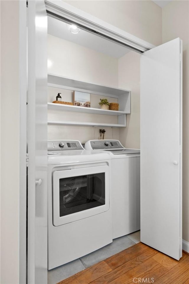 1715 Stanford Ave, Redondo Beach, CA 90278 - laundry room with washing machine and clothes dryer and light wood-style floors
