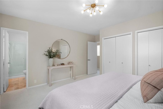 1715 Stanford Ave, Redondo Beach, CA 90278 - carpeted bedroom featuring two closets, a chandelier, and ensuite bath