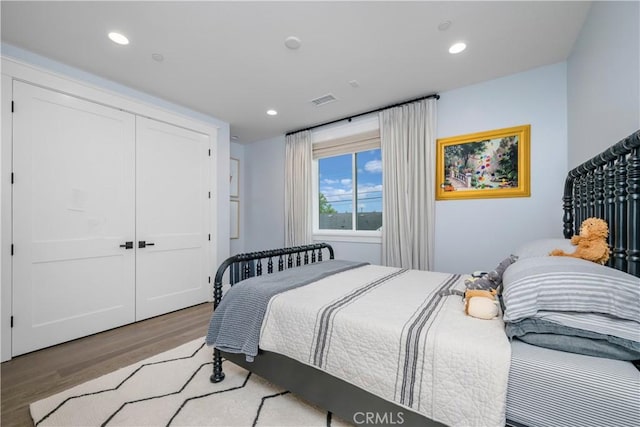 11385 Baskerville Rd, Rossmoor, CA 90720 - bedroom with light wood finished floors, recessed lighting, and a closet