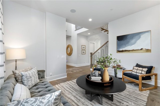 11385 Baskerville Rd, Rossmoor, CA 90720 - living area featuring arched walkways, wood finished floors, recessed lighting, and stairway