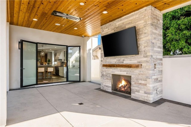 11385 Baskerville Rd, Rossmoor, CA 90720 - view of patio featuring an outdoor stone fireplace