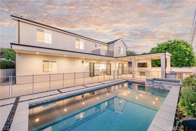 11385 Baskerville Rd, Rossmoor, CA 90720 - view of swimming pool with a patio area and a pool with connected hot tub