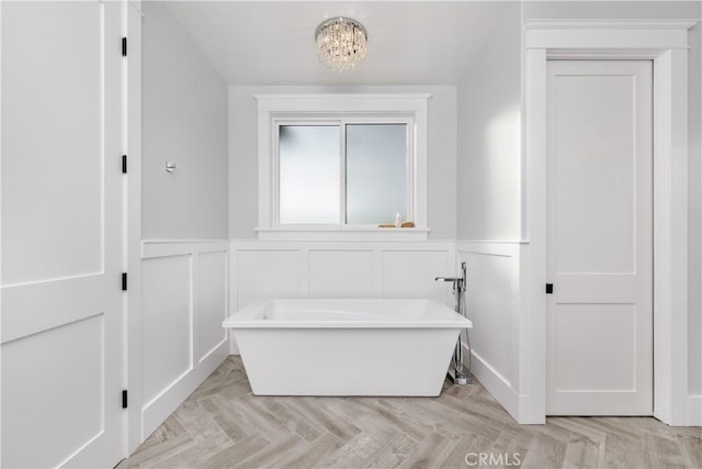 11385 Baskerville Rd, Rossmoor, CA 90720 - full bathroom with a freestanding bath, a decorative wall, and a wainscoted wall