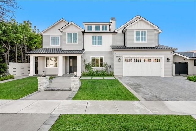 11385 Baskerville Rd, Rossmoor, CA 90720 - view of front facade featuring a standing seam roof, driveway, board and batten siding, a garage, and a metal roof