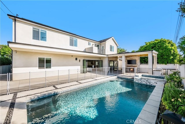 11385 Baskerville Rd, Rossmoor, CA 90720 - back of property with stucco siding, a patio area, a pool with connected hot tub, and area for grilling