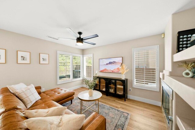 641 Hillhaven Dr, San Marcos, CA 92078 - living area with light wood-style flooring and ceiling fan