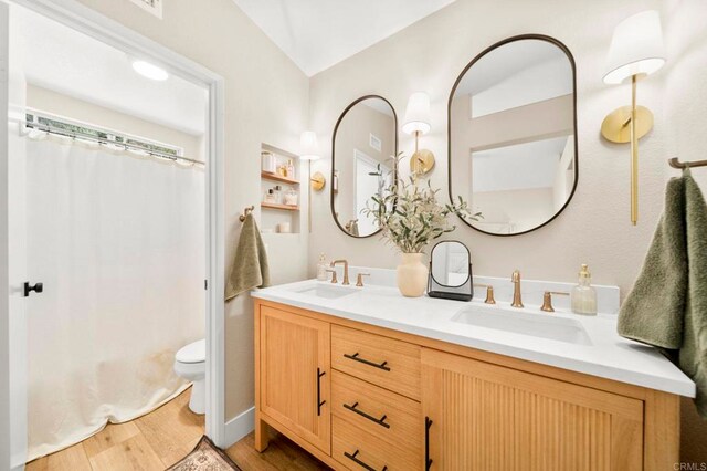 641 Hillhaven Dr, San Marcos, CA 92078 - full bath featuring double vanity, wood finished floors, and shower / bathtub combination with curtain