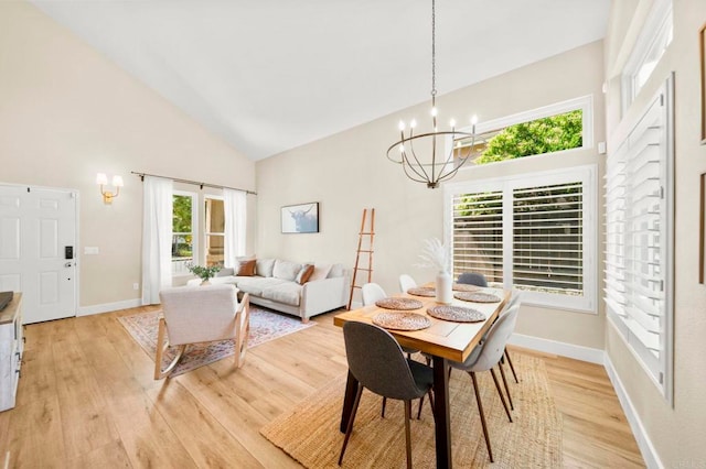 641 Hillhaven Dr, San Marcos, CA 92078 - dining area with high vaulted ceiling, a chandelier, and light wood finished floors