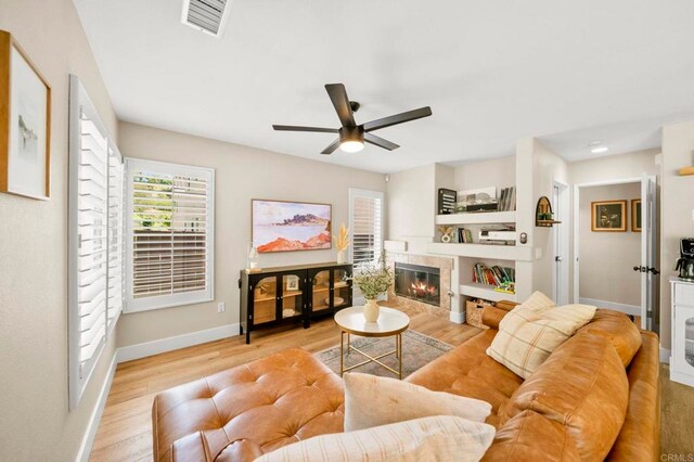 641 Hillhaven Dr, San Marcos, CA 92078 - living room with wood finished floors, ceiling fan, and a premium fireplace