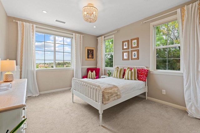 7691 Circulo Sequoia, Carlsbad, CA 92009 - carpeted bedroom with multiple windows and a chandelier