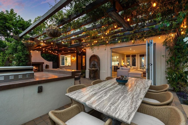 7691 Circulo Sequoia, Carlsbad, CA 92009 - view of patio featuring an outdoor kitchen, a pergola, and outdoor dining space