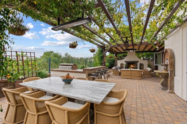 7691 Circulo Sequoia, Carlsbad, CA 92009 - view of patio / terrace featuring a lit fireplace, area for grilling, a pergola, and outdoor dining area