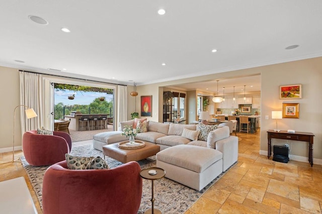 7691 Circulo Sequoia, Carlsbad, CA 92009 - living room with crown molding, recessed lighting, and stone tile flooring