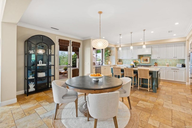 7691 Circulo Sequoia, Carlsbad, CA 92009 - dining space with stone tile flooring, ornamental molding, and recessed lighting