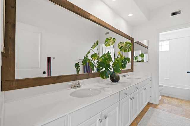 7691 Circulo Sequoia, Carlsbad, CA 92009 - bathroom with double vanity, stone finish flooring, recessed lighting, and shower / bath combination