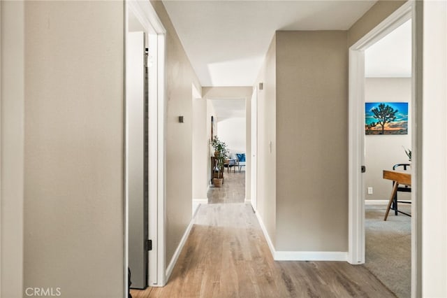 2406 S Pacific Ave, Santa Ana, CA 92704 - hallway featuring baseboards and light wood-type flooring