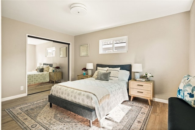 2406 S Pacific Ave, Santa Ana, CA 92704 - bedroom featuring wood finished floors, a closet, and multiple windows