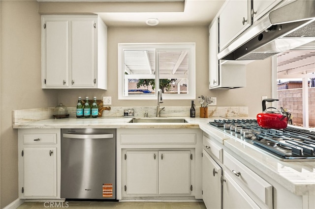 2406 S Pacific Ave, Santa Ana, CA 92704 - kitchen with stainless steel appliances, plenty of natural light, under cabinet range hood, and light countertops