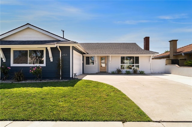 2406 S Pacific Ave, Santa Ana, CA 92704 - view of front of property with driveway, a garage, a chimney, and a shingled roof