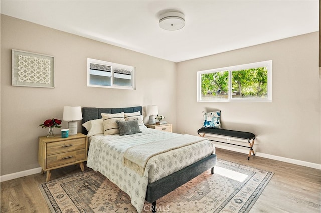2406 S Pacific Ave, Santa Ana, CA 92704 - bedroom featuring baseboards and wood finished floors