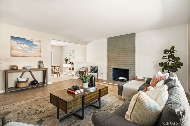 2406 S Pacific Ave, Santa Ana, CA 92704 - living room featuring wood finished floors and a fireplace