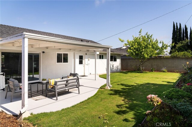 2406 S Pacific Ave, Santa Ana, CA 92704 - rear view of house with a fenced backyard, a patio, roof with shingles, and stucco siding