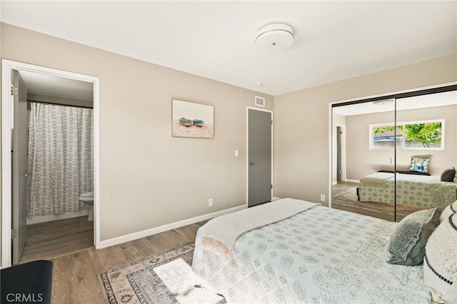 2406 S Pacific Ave, Santa Ana, CA 92704 - bedroom featuring wood finished floors, a closet, and ensuite bath