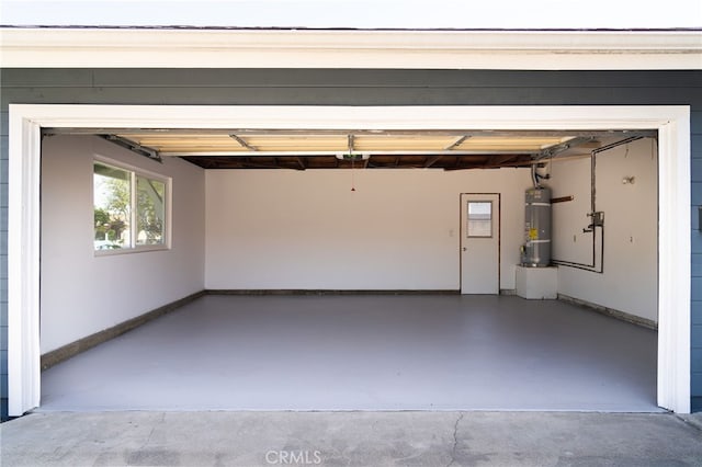 2406 S Pacific Ave, Santa Ana, CA 92704 - garage featuring water heater and baseboards