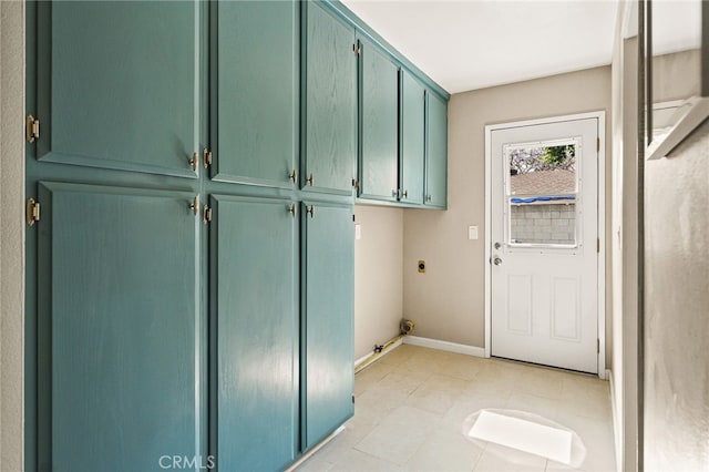 2406 S Pacific Ave, Santa Ana, CA 92704 - washroom featuring cabinet space, hookup for an electric dryer, and light tile patterned floors
