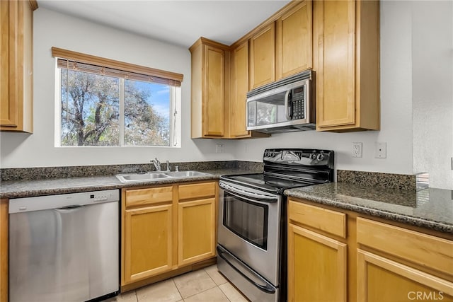 2275 Del Mar Way Unit 307, Corona, CA 92882 - kitchen featuring stainless steel appliances, dark countertops, and light tile patterned floors