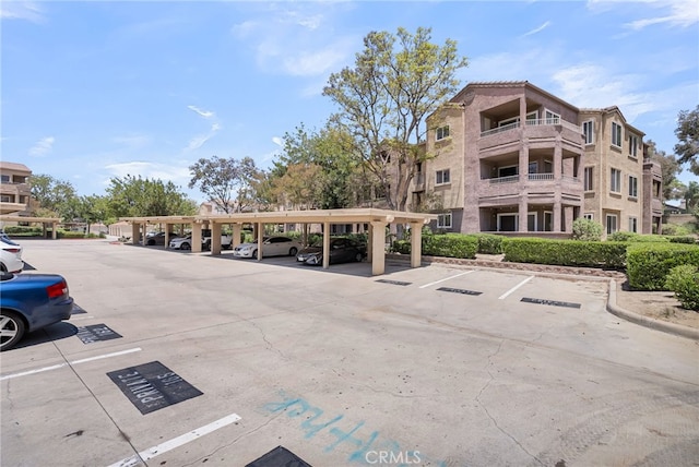 2275 Del Mar Way Unit 307, Corona, CA 92882 - view of property featuring covered and uncovered parking