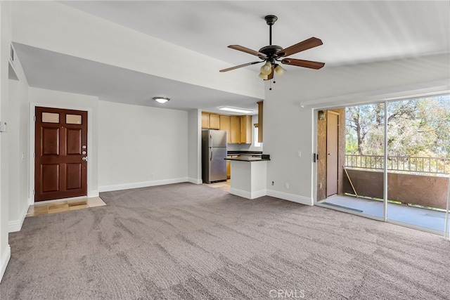 2275 Del Mar Way Unit 307, Corona, CA 92882 - unfurnished living room featuring light colored carpet, ceiling fan, and vaulted ceiling