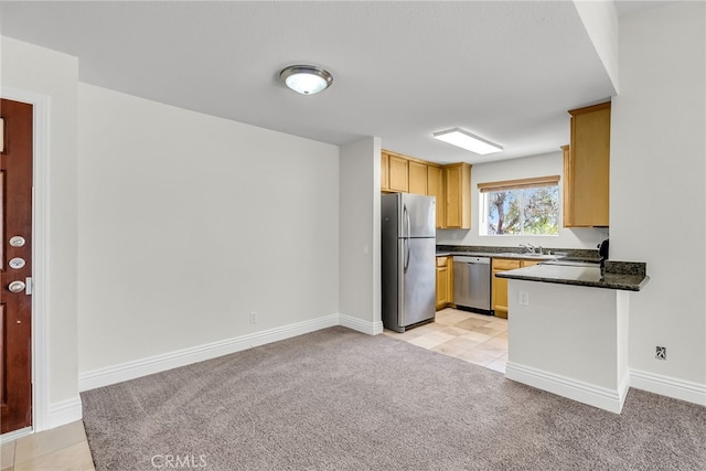 2275 Del Mar Way Unit 307, Corona, CA 92882 - kitchen featuring appliances with stainless steel finishes and light colored carpet