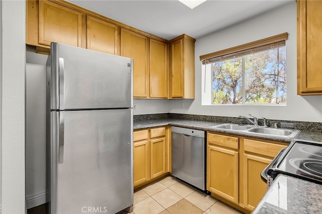 2275 Del Mar Way Unit 307, Corona, CA 92882 - kitchen with appliances with stainless steel finishes, light tile patterned floors, and dark countertops