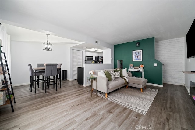 3051 Knollwood Ave, La Verne, CA 91750 - living room with wood finished floors and a chandelier